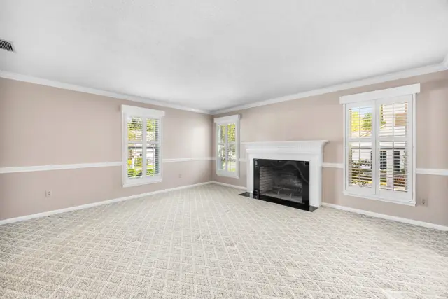 Family room with fireplace and natural light
