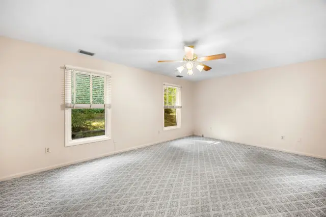 Primary bedroom with ceiling fan
